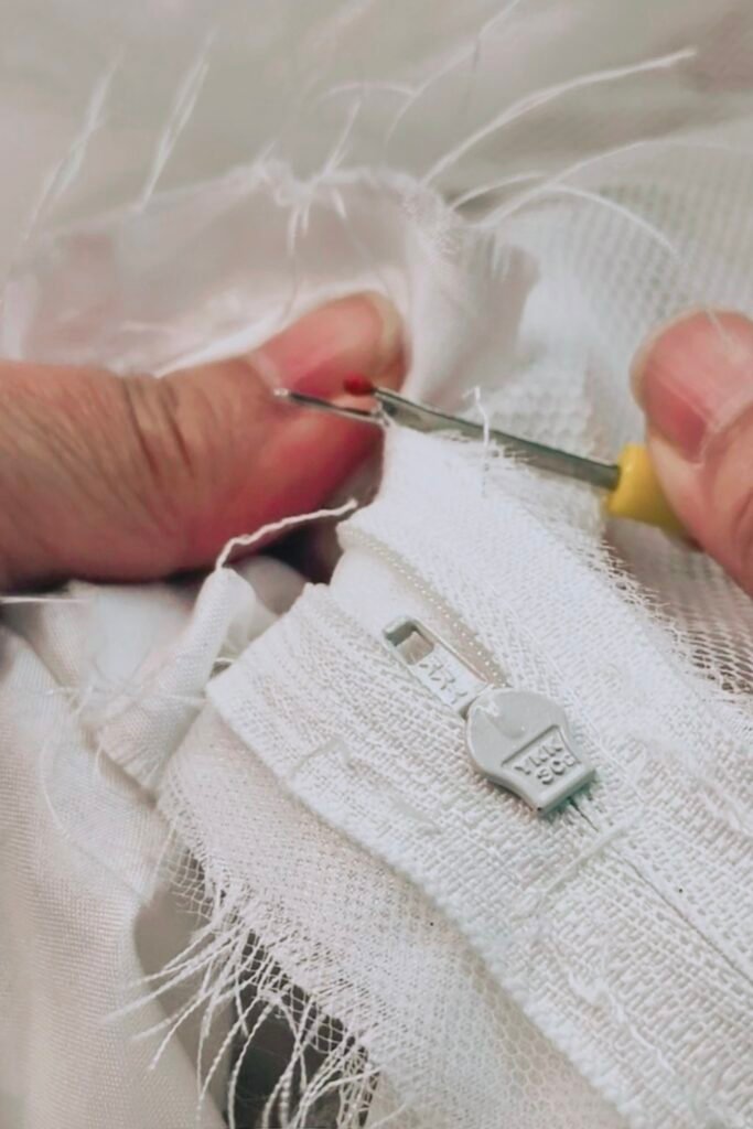 Corset loops being made for wedding dress restyling